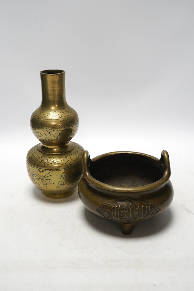 A Chinese bronze tripod censer and a similar double gourd vase, 21cm. Condition - poor to fair, vase has obvious repair to body